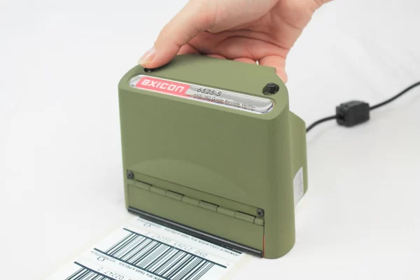 Axicon 6525 barcode verifier checking a printed label at Jain Transfer Products, Noida